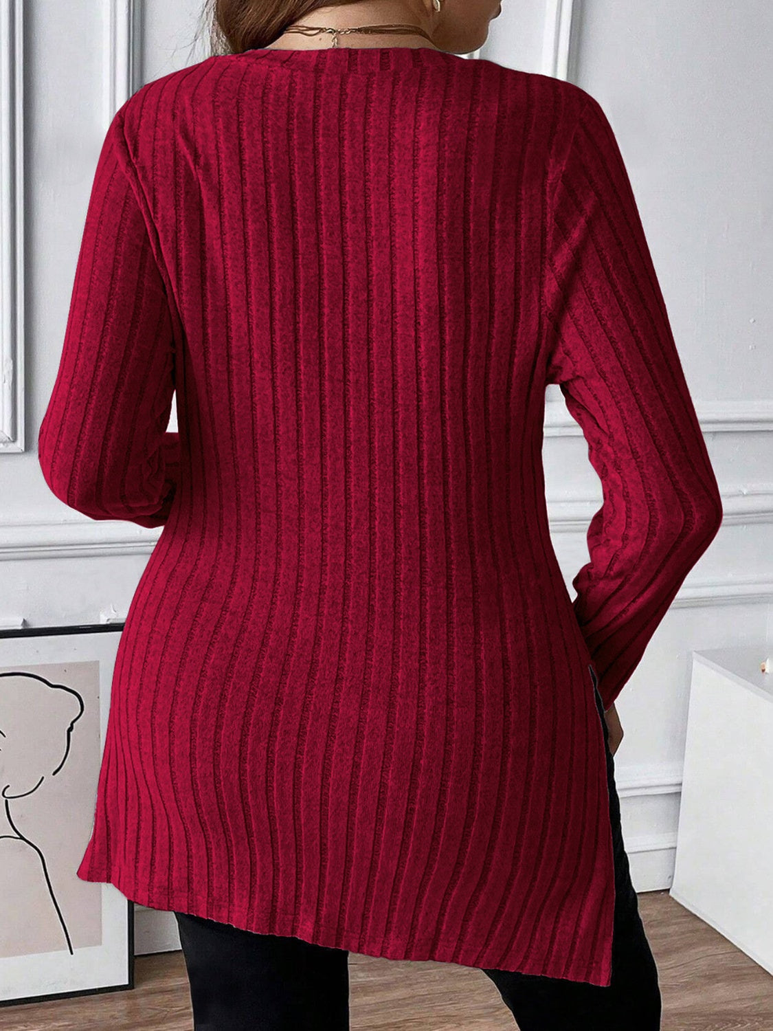 Burgundy ribbed knit tunic with square neckline and long sleeves.