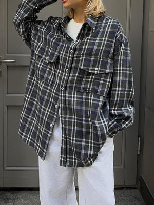 Plaid pocketed button-up shacket in dark navy with button closures and chest pockets.