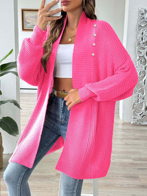 Pearl button ribbed knit cardigan in strawberry pink with a relaxed fit and open front.