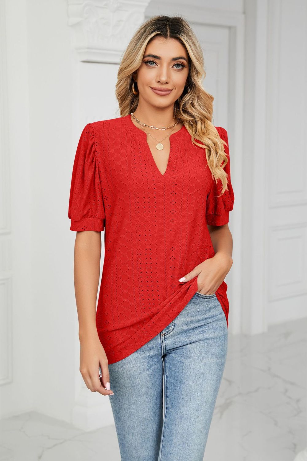 Scarlett perforated puff sleeve blouse with keyhole neckline and allover eyelet pattern.