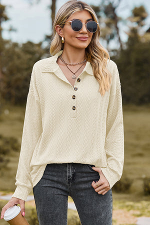 Cream textured polo-neck sweater with button detail and long sleeves.