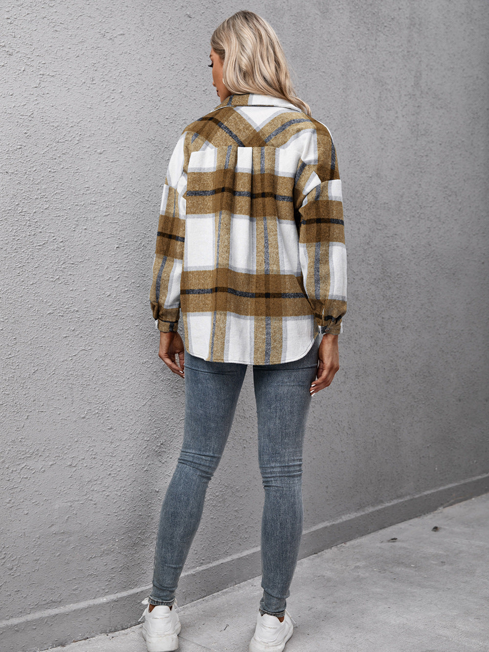 Overshirt with camel plaid pattern, oversized fit, button-up front, and long sleeves.