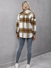 Overshirt with camel plaid pattern, oversized fit, button-up front, and long sleeves.