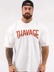 White oversized graphic tee with red THAVAGE print and short sleeves.