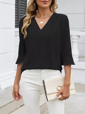 Black V-neck blouse with 3/4 sleeves featuring lace trim at the cuffs.
