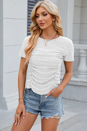 White eyelet tee with short sleeves and ruched front detail.