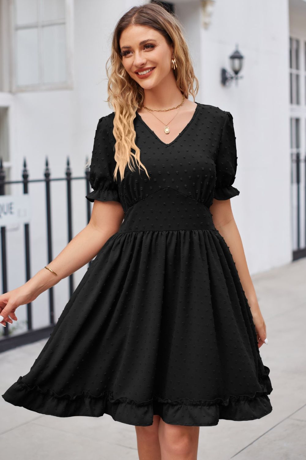 Black textured dot puff sleeve fit-and-flare dress with ruffled hem
