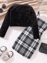 Black fuzzy cardigan with a plaid dress, a cozy outfit for babies.