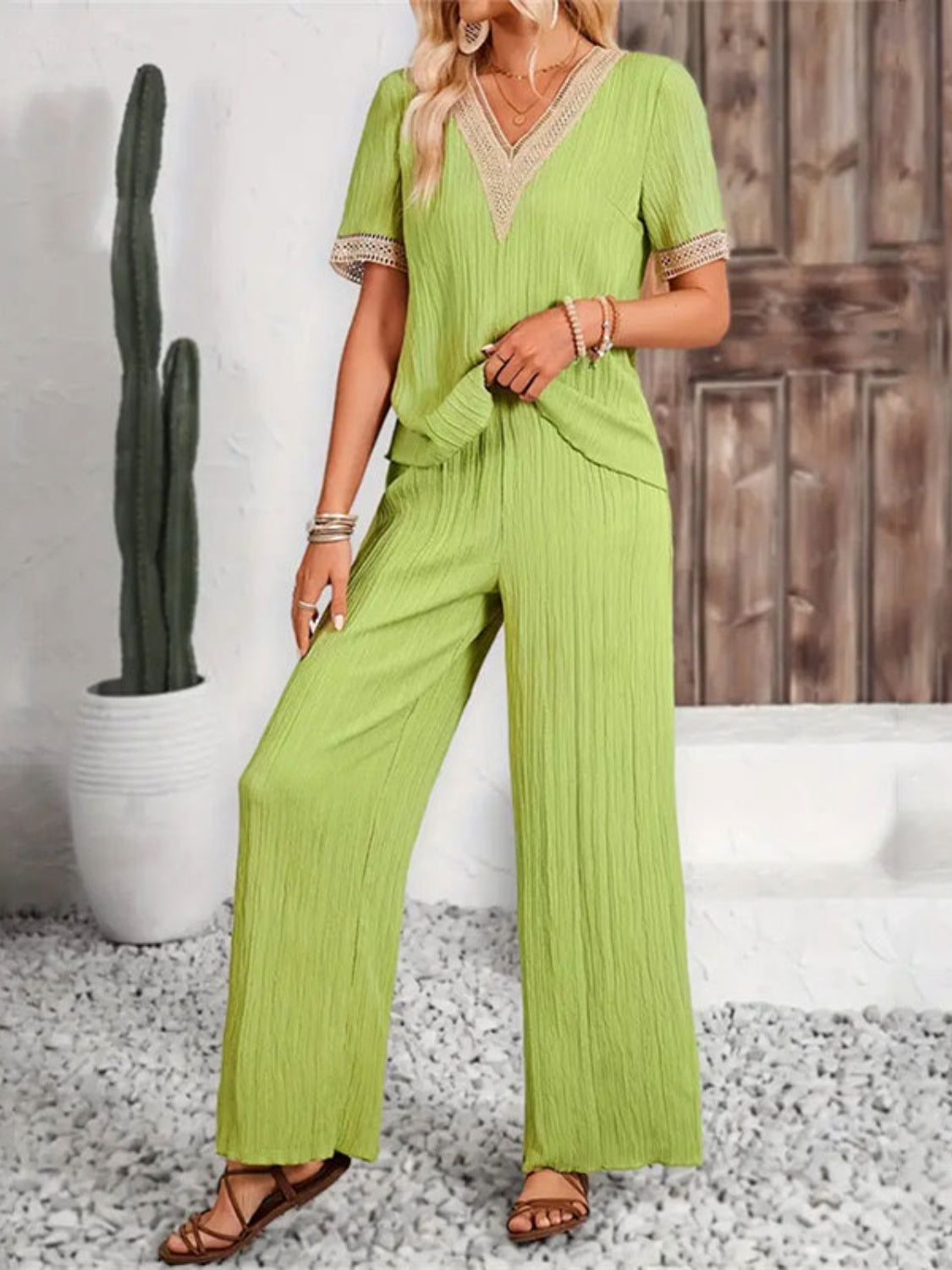 Lime crinkle knit v-neck co-ord set with lace trim and wide leg pants.
