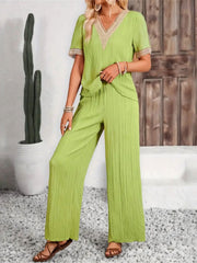 Lime crinkle knit v-neck co-ord set with lace trim and wide leg pants.