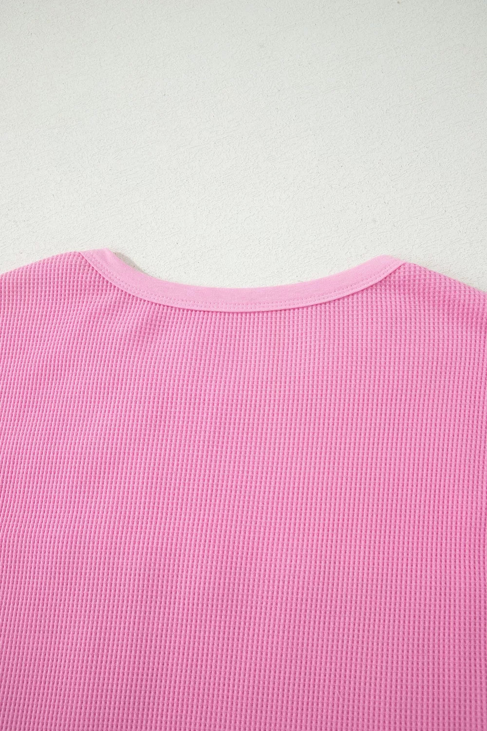 Pink waffle knit t-shirt with crew neck and pocket detail