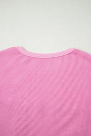 Pink waffle knit t-shirt with crew neck and pocket detail