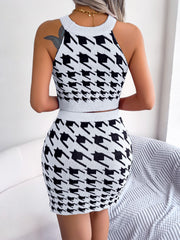 Houndstooth knit halter crop top and mini skirt set in white and black.