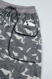 Camouflage barrel pants with cargo pockets and drawstring waist.