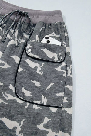 Camouflage barrel pants with cargo pockets and drawstring waist.