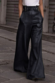 Black wide-leg leather pants with buckle belt and pleats
