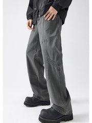Gray cotton wide-leg trousers with panel stitching detail.
