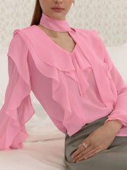 Pink chiffon blouse with V-neck, ruffle trim, and tie detail.