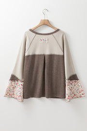 Floral bell sleeve henley top in mocha with contrast floral print cuffs and yoke detail.