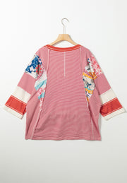 Patchwork stripe raglan sleeve tee in red with colorful boho print accents and contrast cuffs.