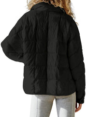 Black quilted bomber jacket with stand collar and button cuff detail