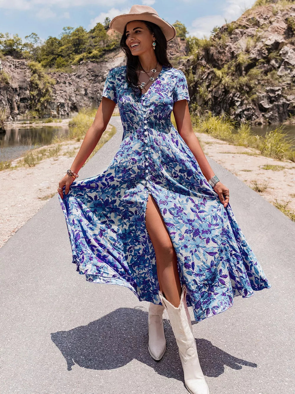 Blue floral v-neck midi dress with short sleeves, button front, and high slit.