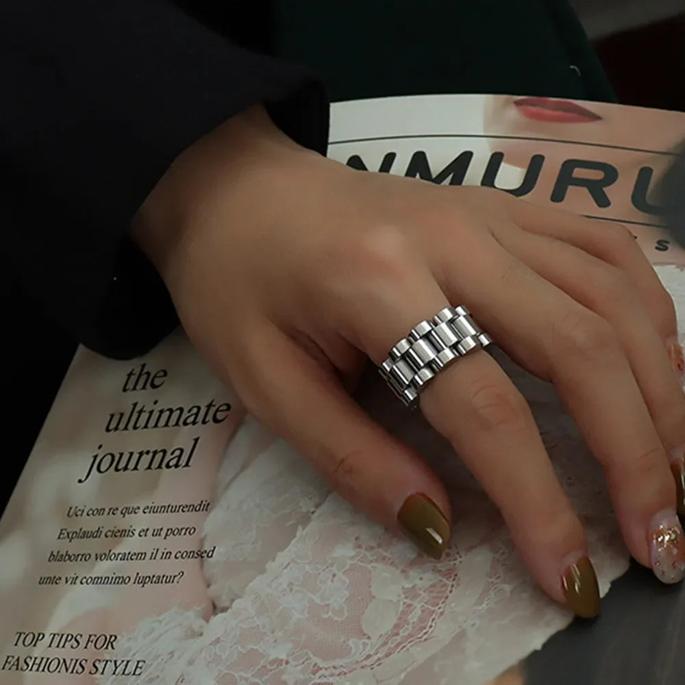 Watch link statement ring in silver with a bold, segmented design.