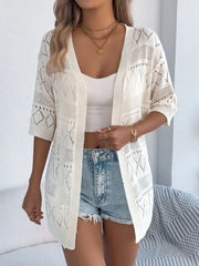 Cream openwork knit duster cardigan with short sleeves and diamond pattern.
