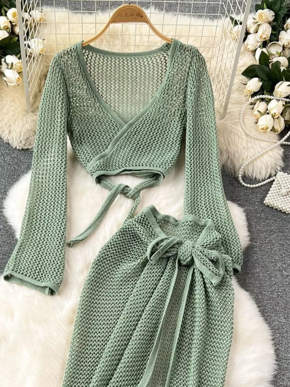 Green knit crop top with tie waist and matching high slit skirt set.