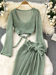 Green knit crop top with tie waist and matching high slit skirt set.
