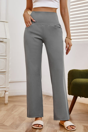 High-waisted flare leg trousers in gray with side pockets.