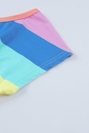 Rainbow stripe romper with elastic waist and peach trim detail