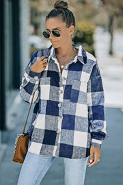Oversized blue and white checkered shacket with button-down front and patch pocket.