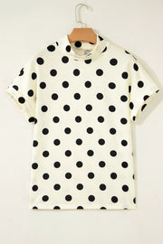 Polyester t-shirt with black polka dots, short sleeves, and high neck.