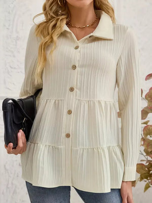 Cream textured tiered button-down shirt with crinkled fabric and button details.