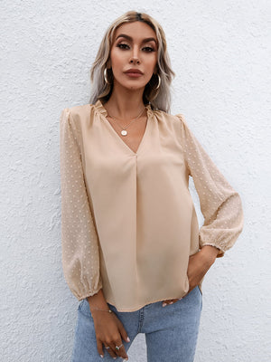 Khaki Swiss dot sleeve gathered blouse with V-neck and cinched cuffs.