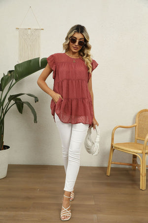 Swiss dot flutter sleeve tiered blouse in Brick Red with round neckline and short sleeves.