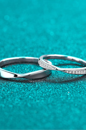Silver band rings, one plain twisted, one with small clear stones