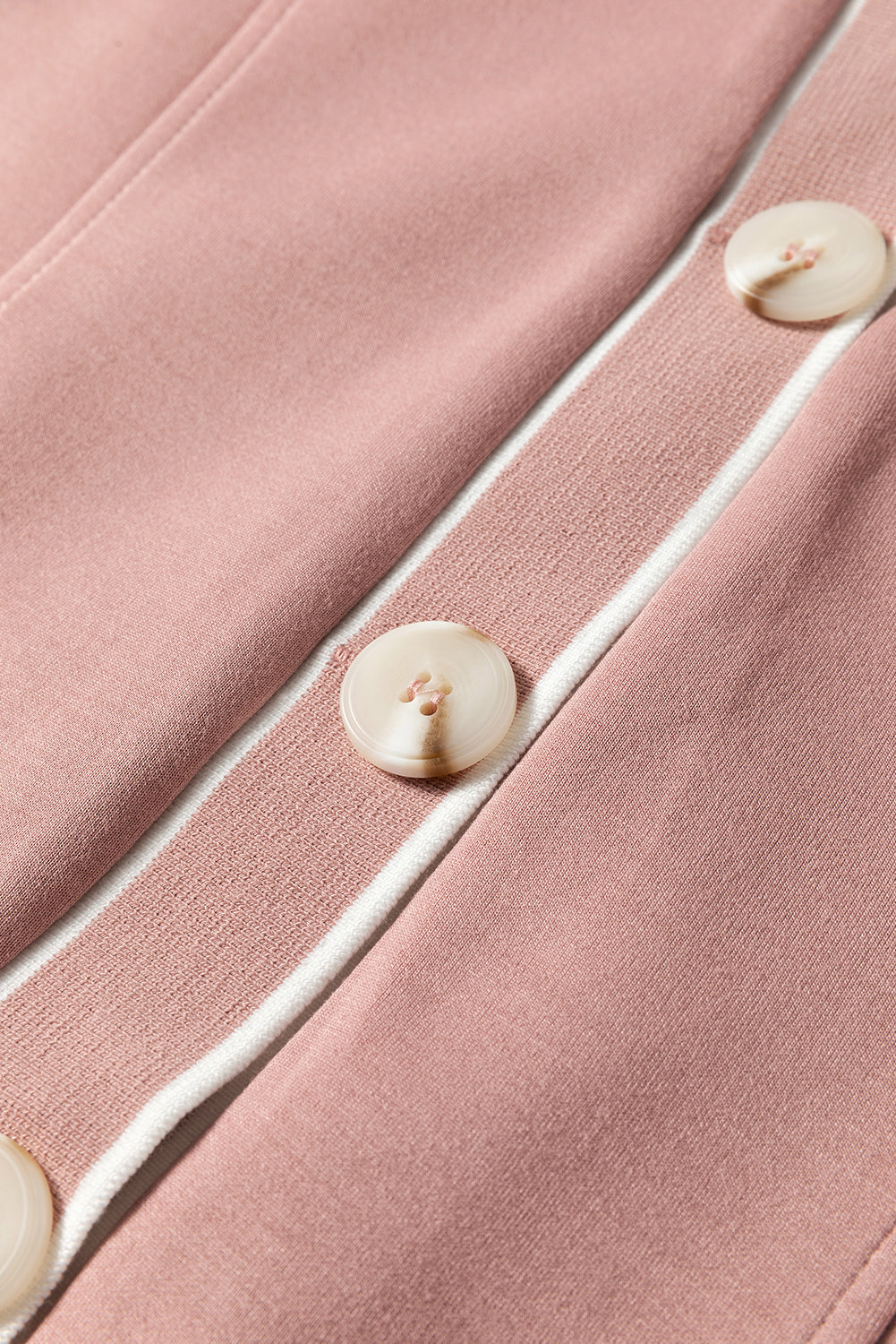 Dusty pink cardigan with varsity trim and button details