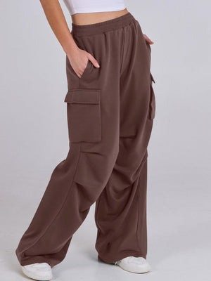 Dark brown sweatpants with cargo pockets and a wide leg cut.