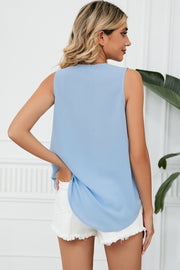 Light blue V-neck tank top with lace trim and a curved hem.