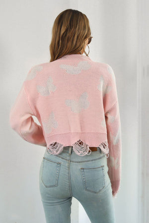 Pink acrylic knit cropped sweater with butterfly intarsia and frayed hem