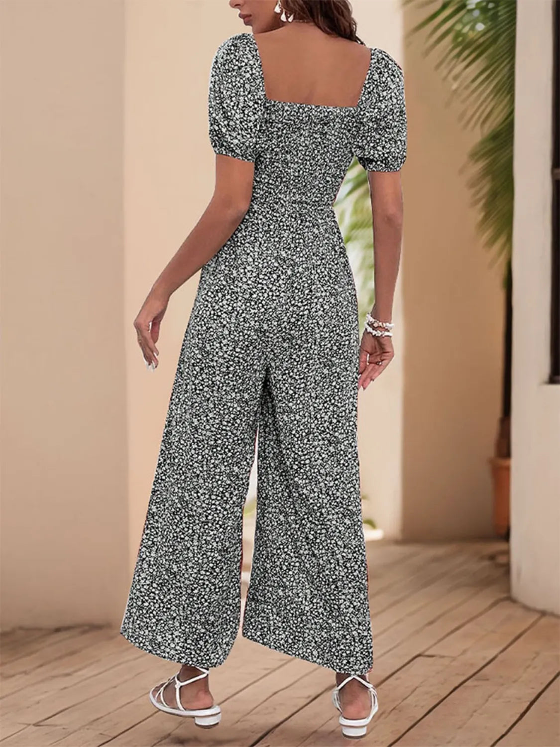 Smocked bodice floral wide-leg jumpsuit with puff sleeves and square neckline in Black White.