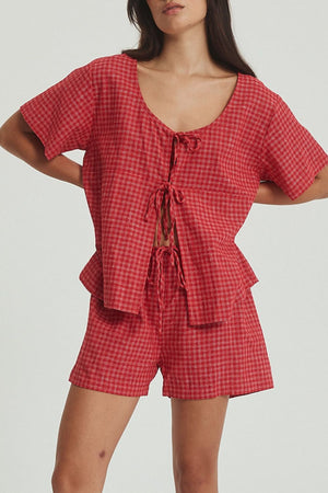 Deep red plaid cotton open-front top with tie detail and matching shorts set