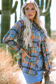 Oversized plaid shacket with button-down collar in orange and blue plaid.