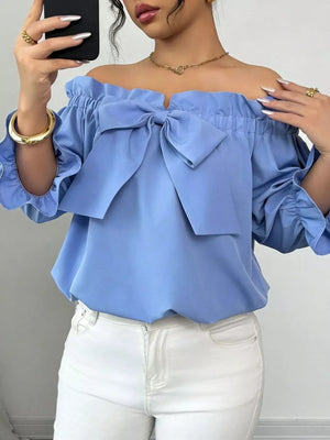 Sky blue off-the-shoulder blouse with ruffled bow detail and elasticized sleeves.
