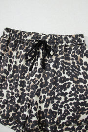 Leopard print lounge shorts with elastic waistband and drawstring.
