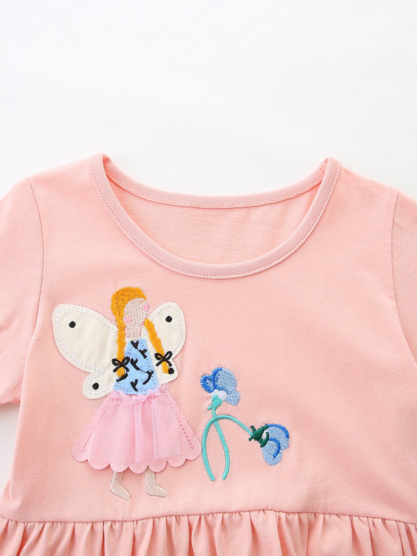 Pink cotton toddler dress with fairy appliqué and ruffled hem