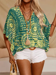 Bohemian print green v-neck t-shirt with short dolman sleeves.