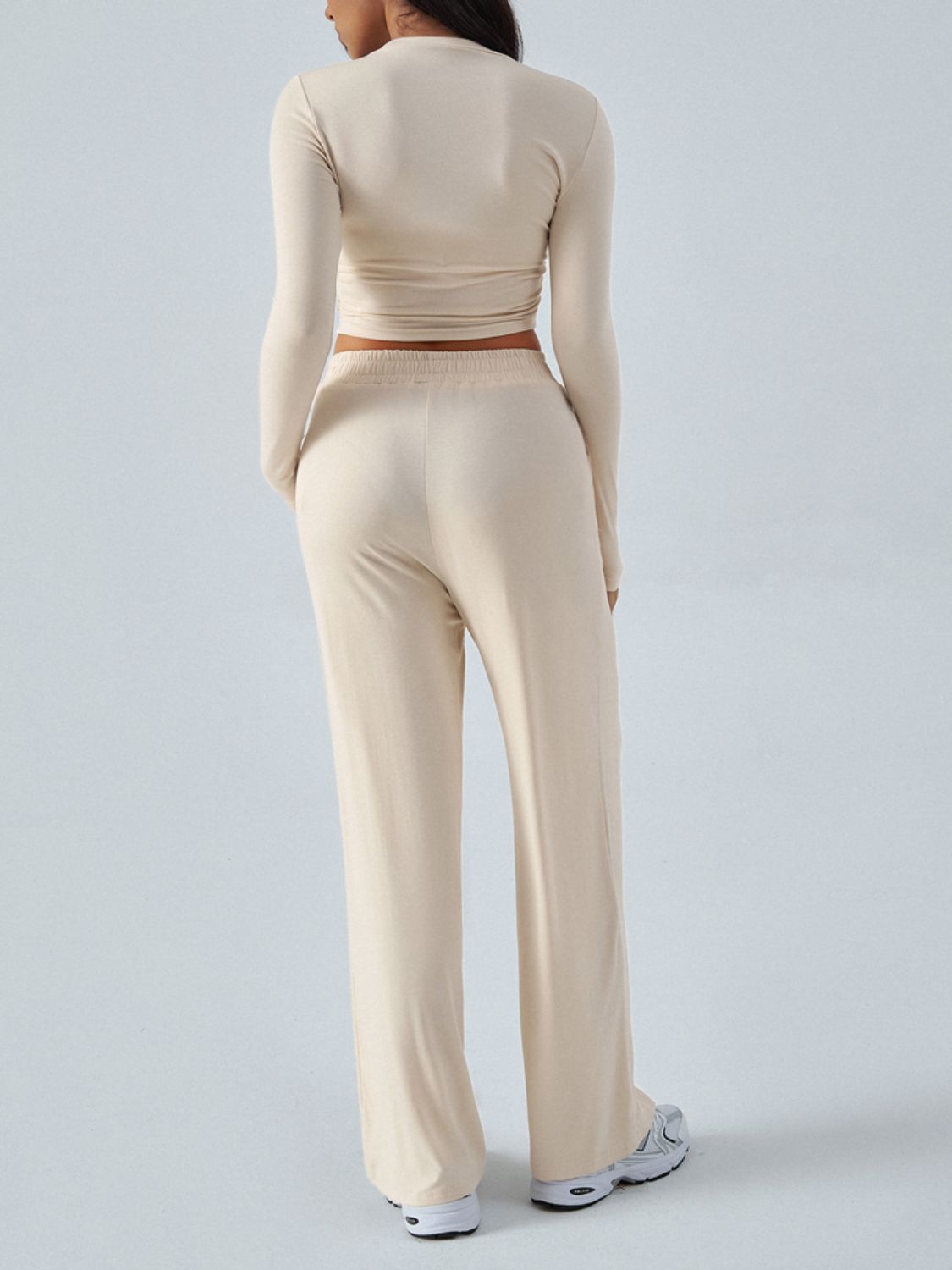 Tan ribbed knit crop top and wide leg pants set with elastic waistband.